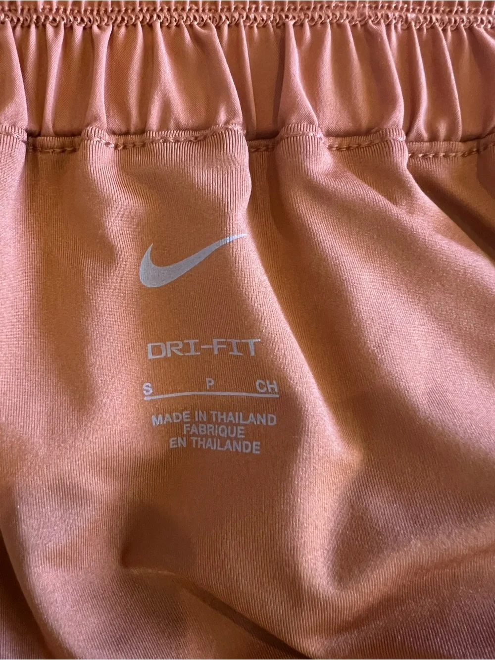Nike Women's High-Waist Athletic Shorts in Burnt Orange with White Logos